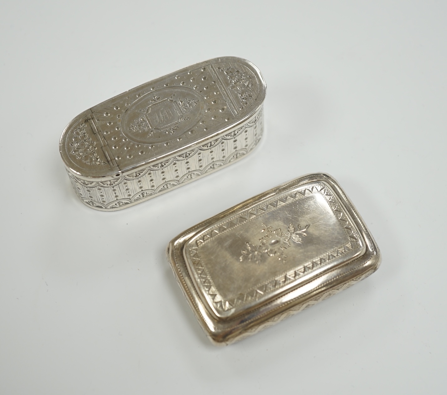 A George III engraved silver oval snuff box, by Phipps & Robinson, London, 1793, 70mm and one other Georgian silver snuff box.